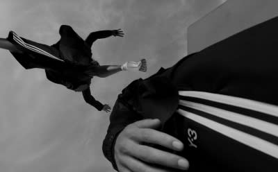 A photograph from below of two freerunners dressed in Y-3.
