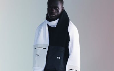 A man models a black and white adidas Y-3 jacket.