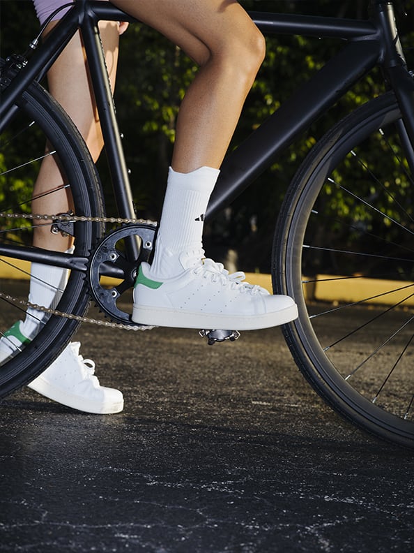 Model on bike with close up of product