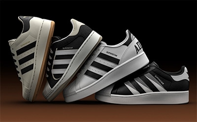 The image shows a pair of black and white Adidas sneakers with distinctive stripes and a platform sole, resting on a dark background.