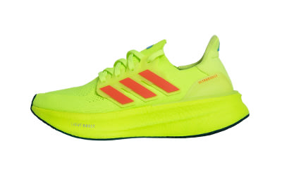 A bright neon green athletic shoe with red accents sits on a plain white background.