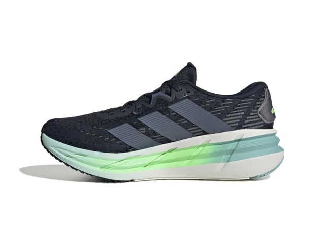 A pair of black and mint green athletic shoes with a thick, curved sole and a textured upper design.