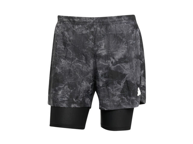 The image shows a pair of black and gray camouflage-patterned athletic shorts with a layered design.