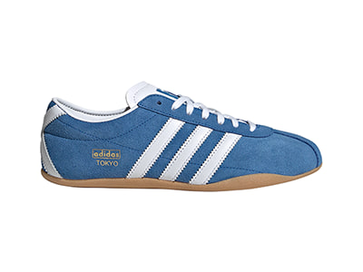 A pair of blue and white Adidas Tokyo sneakers with a gum sole, set against a plain white background.