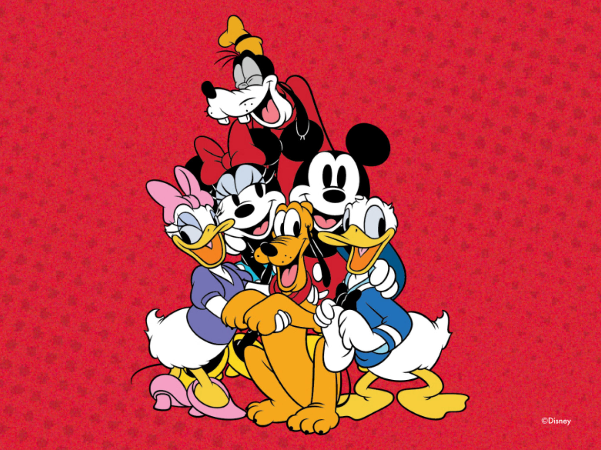 A group of iconic Disney characters, including Mickey Mouse, Minnie Mouse, Donald Duck, and Pluto, are gathered together on a vibrant red background.