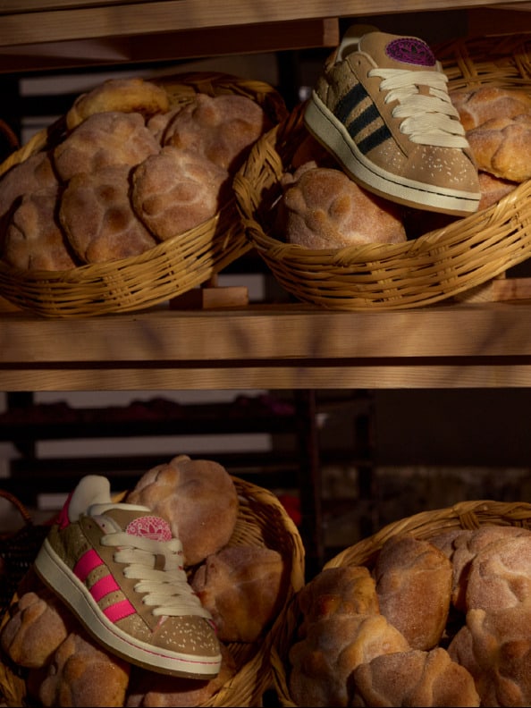 Baskets filled with freshly baked bread and a pair of sneakers on the shelves in the background.