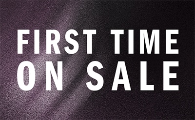 The image displays the text "FIRST TIME ON SALE" against a dark, textured background.