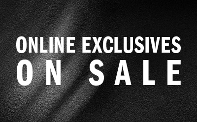 The image displays the text "ONLINE EXCLUSIVES ON SALE" against a dark, textured background.