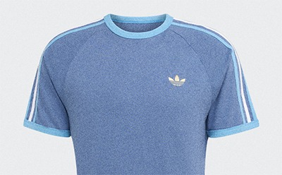 A blue Adidas t-shirt with white stripes on the sleeves against a plain white background.