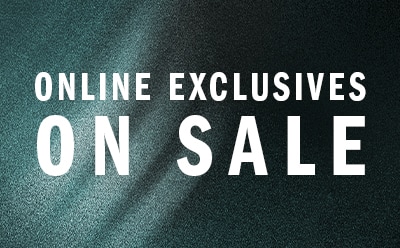 The image displays a large white text on a dark green background, stating "ONLINE EXCLUSIVES ON SALE".