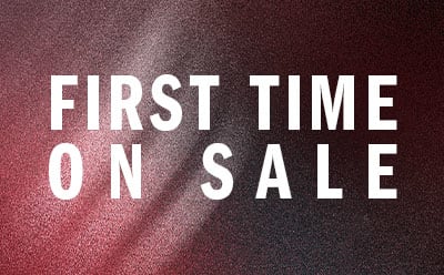 The image displays the text "FIRST TIME ON SALE" against a burgundy or maroon-colored background.