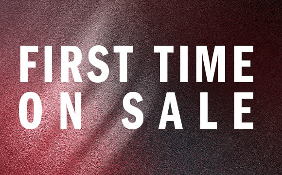 The image displays the text "FIRST TIME ON SALE" against a burgundy-colored background.