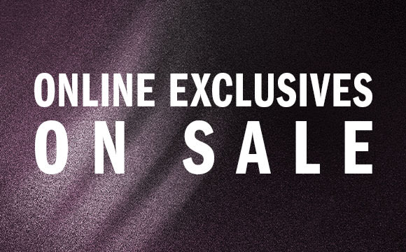 The image displays the text "ONLINE EXCLUSIVES ON SALE" against a dark, textured background.