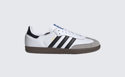 A white and black sneaker with a gray sole is displayed against a plain white background.