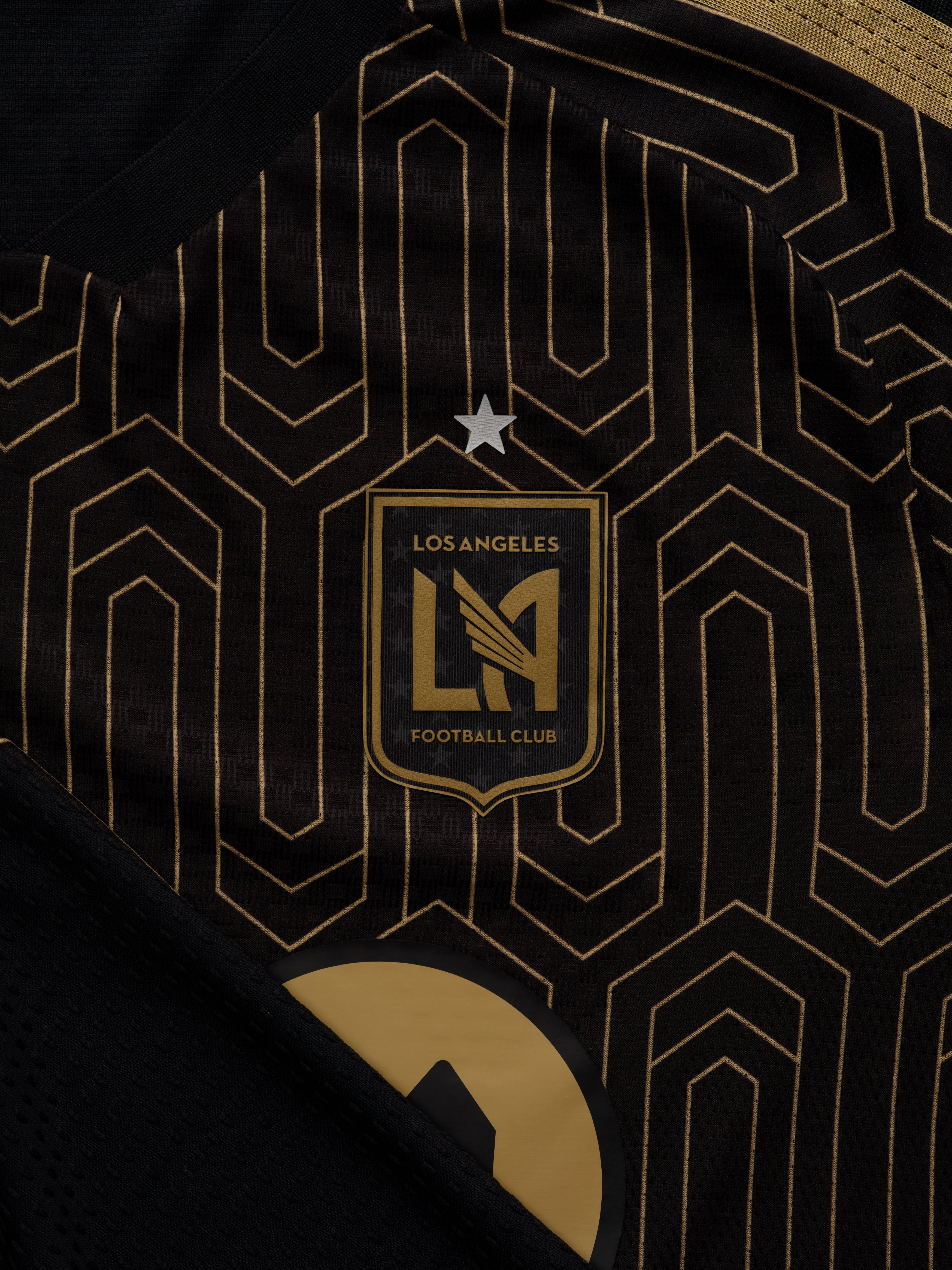 The image features the logo of the Los Angeles Football Club (LAFC) prominently displayed against a dark background with intricate geometric patterns.
