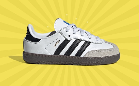 A white and black Adidas Samba sneaker sits on a bright yellow background with radiating lines.