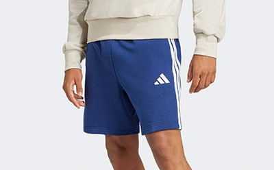 The image shows a pair of blue athletic shorts with the Adidas logo prominently displayed on the side.