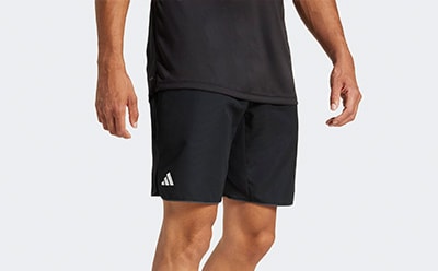 The image shows a pair of black athletic shorts with the Adidas logo visible on the side.