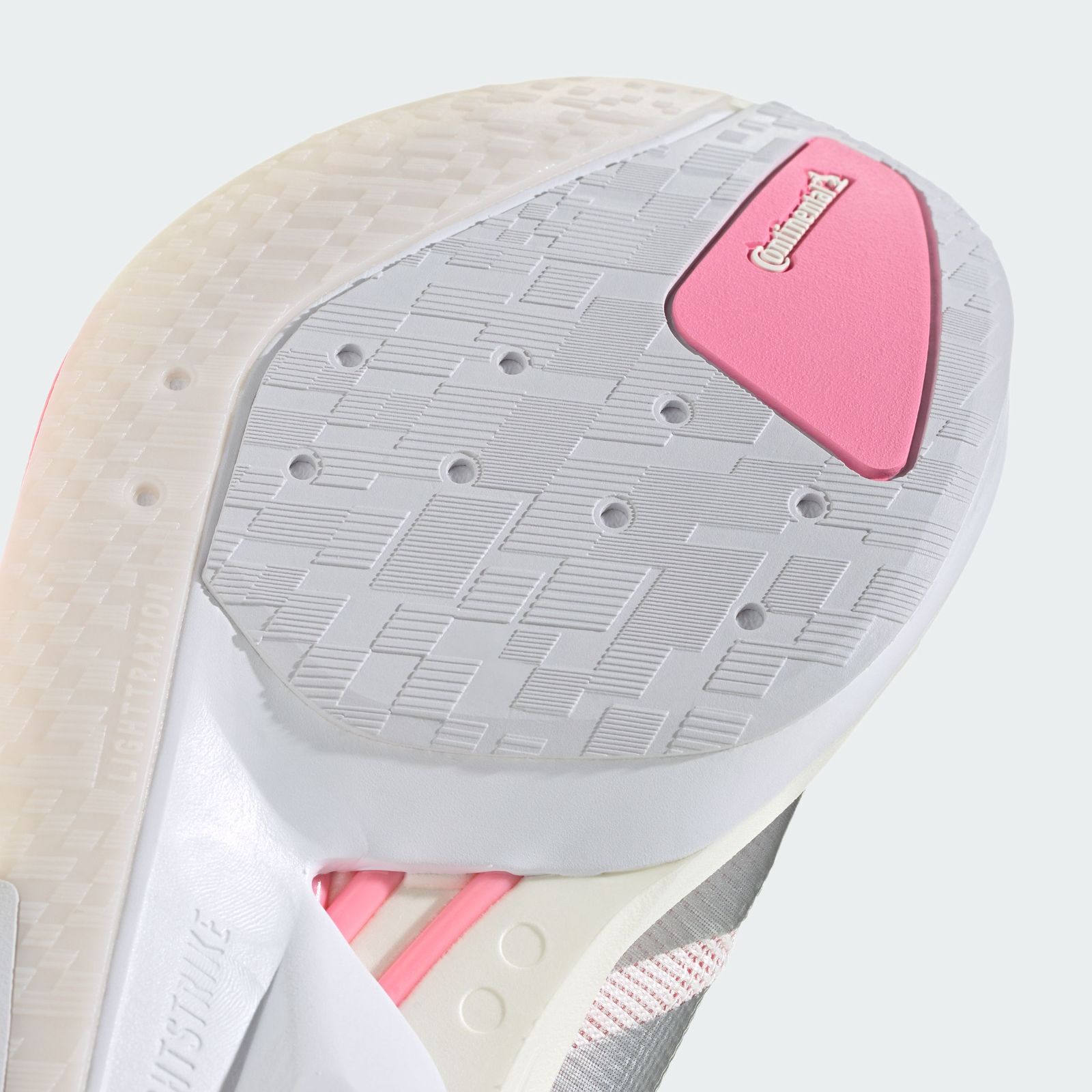 The image shows a white and pink tennis racket head with a textured surface and a distinctive pink accent.