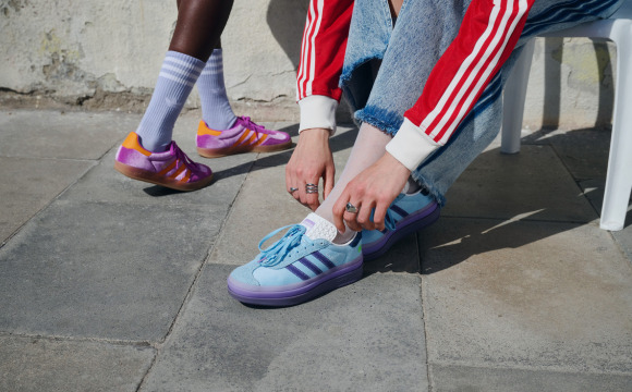 A close-up of someone’s feet wearing a pair of adidas Supernova Rise W Earth Day shoes.