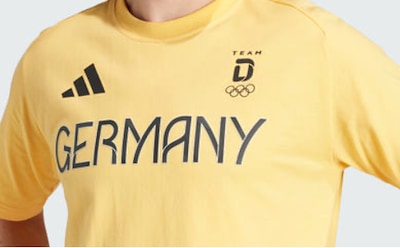 A yellow t-shirt with the text "GERMANY" and the Adidas logo prominently displayed.