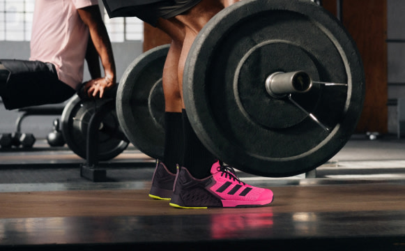 Eric Leija does Romanian Deadlifts in adidas’ Dropset 3s and strength training collection. 