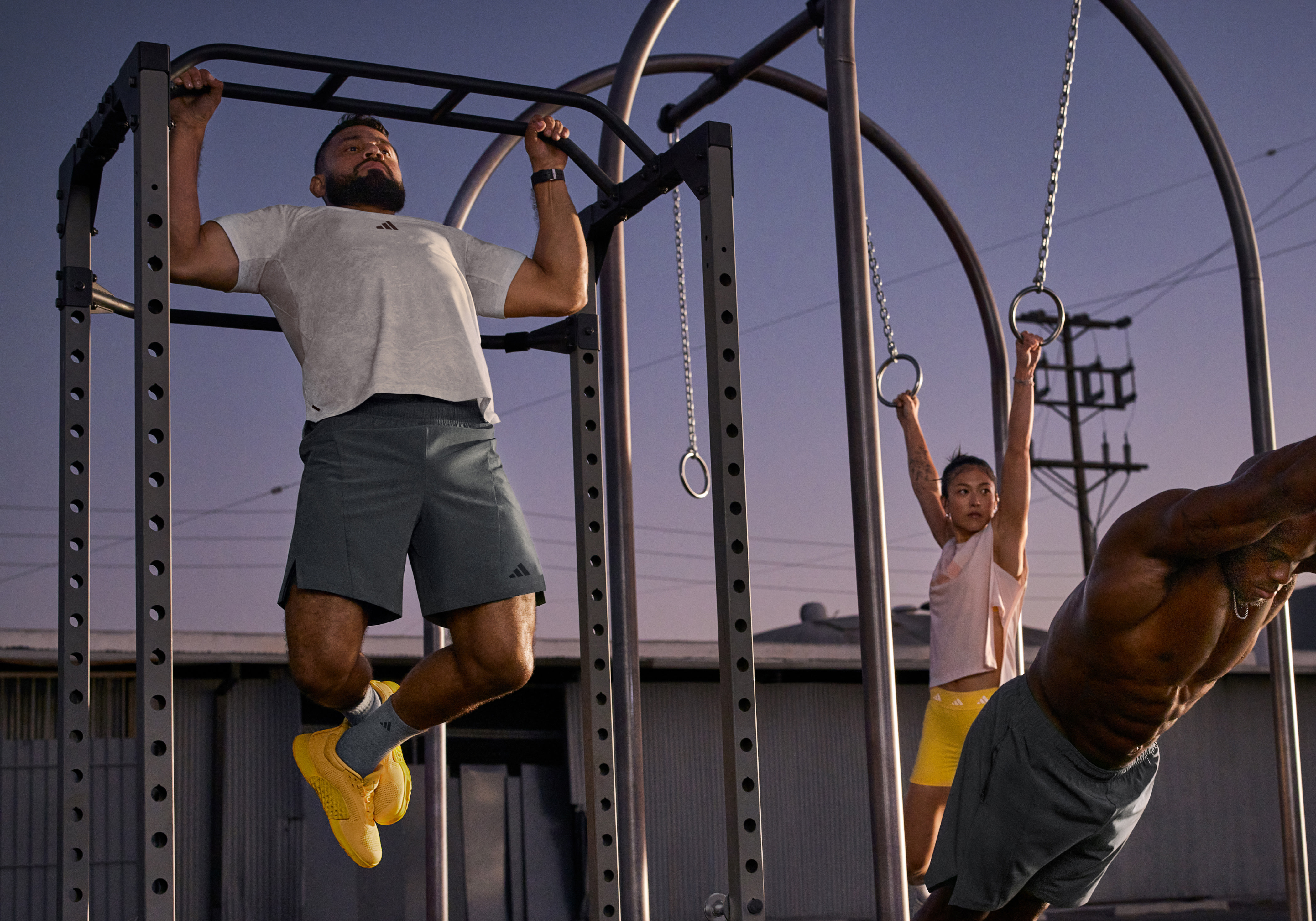 A group of people is exercising, using various workout equipment
