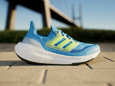 A blue and yellow athletic shoe sits on a wooden platform, with a bridge or structure visible in the background.