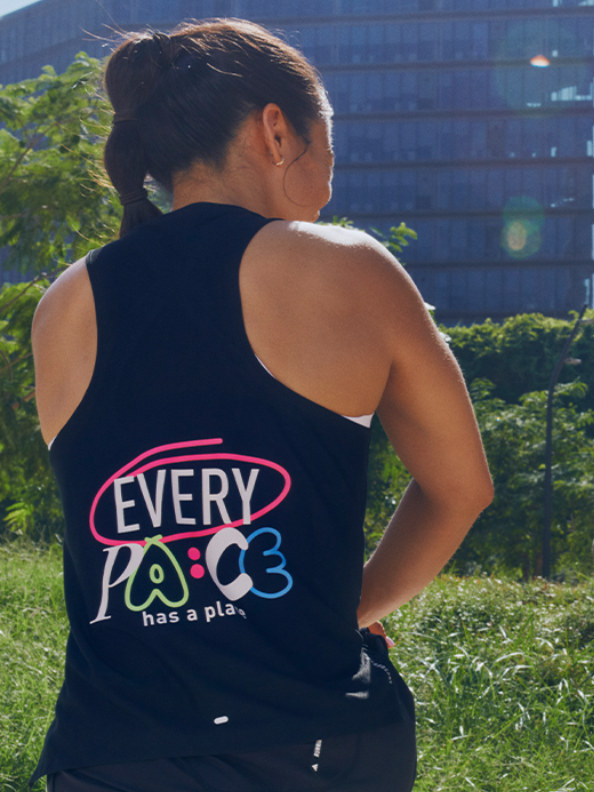 A close up of the black tank from the adidas Runners collection. The text 'Every Pace has a Place can be seen on the back. 