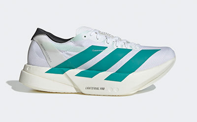A pair of white and teal athletic shoes with a chunky sole and distinctive stripes on the sides, set against a plain white background.
