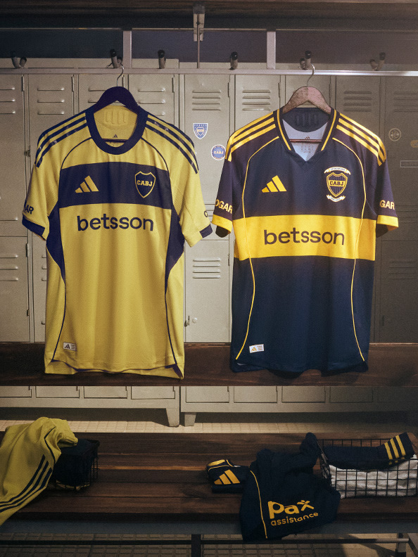 The image shows two yellow and navy blue soccer jerseys with the "Betsson" logo prominently displayed, hanging on a rack in what appears to be a locker room or sports equipment storage area.