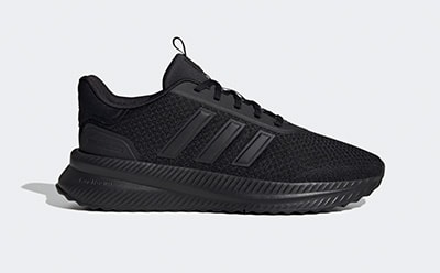 A black, textured sneaker with a thick sole is shown against a plain, light-colored background.