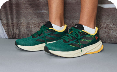 A close-up of someone’s feet wearing a pair of adidas Supernova Rise W Earth Day shoes.