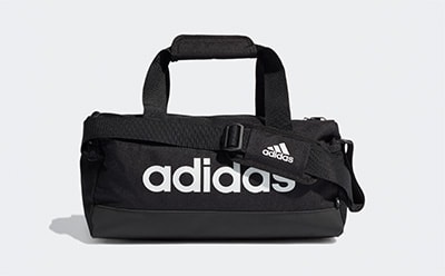 A black Adidas duffel bag with the Adidas logo prominently displayed on the front against a plain white background.