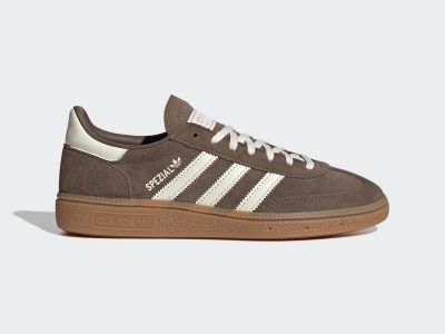 A pair of brown and white Adidas Spezial sneakers with a gum sole, set against a plain white background.