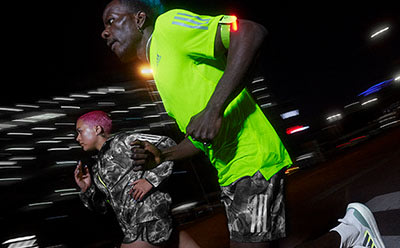two people running at night