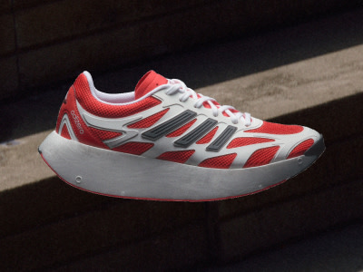 A red and white athletic shoe with a thick platform sole sits on a dark surface, casting a shadow against the background.
