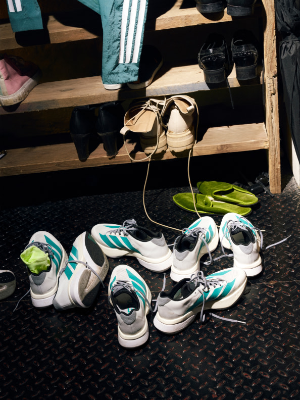 Four images show of various male and female runners wearing the new Adizero Boston 13 in urban settings.