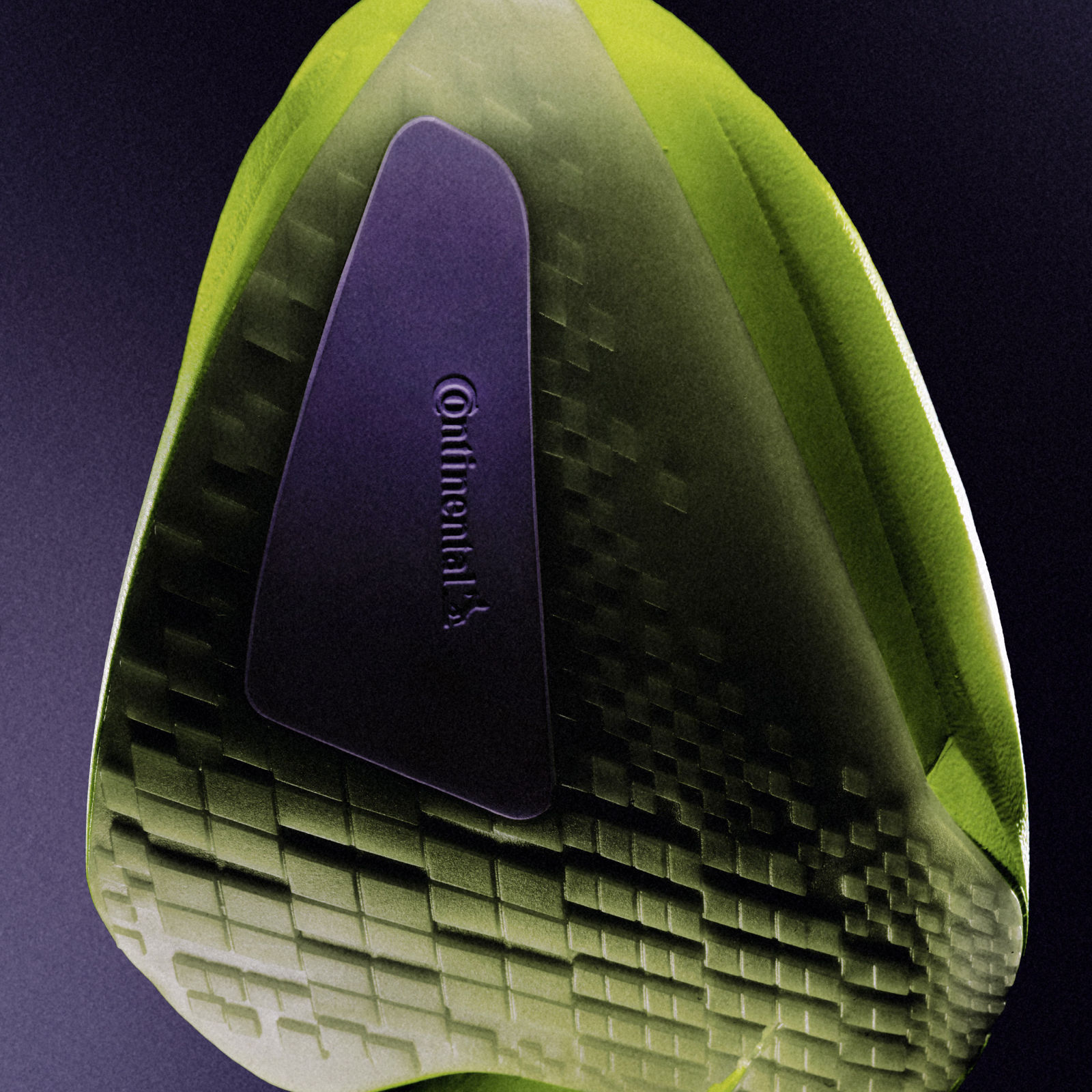 A green and purple abstract geometric shape against a dark background.