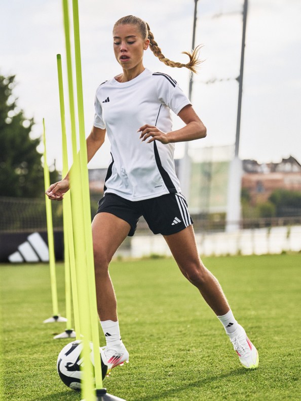 Three female footballers wearing the F50, Predator and Copa during practice
