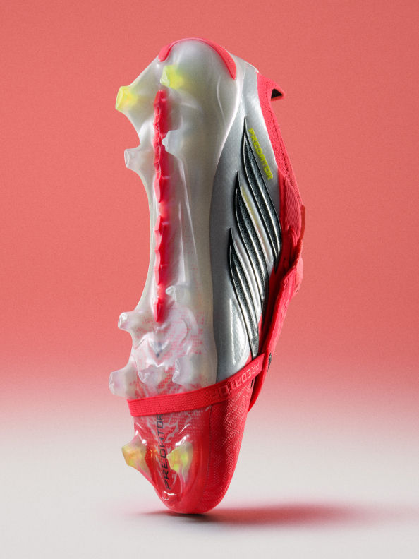 A partially dissected anatomical model of a human foot, with its intricate structures and vibrant colors, stands out against a plain red background.