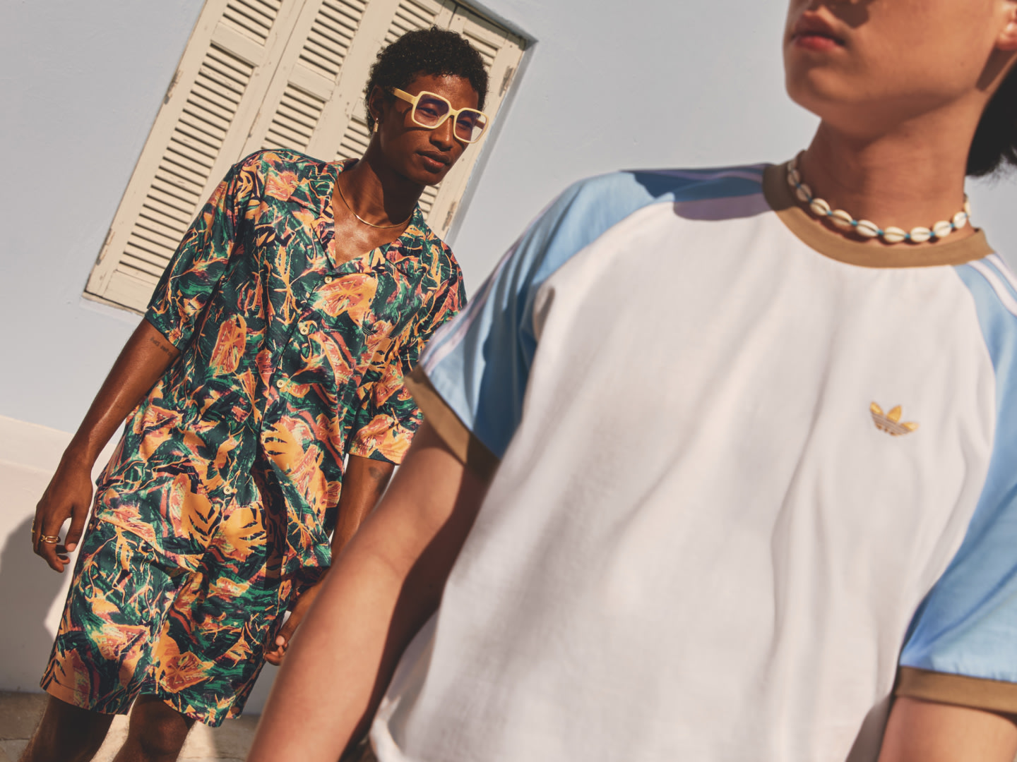 Photograph of two male models wearing adidas 2025 Summer Glow collection.