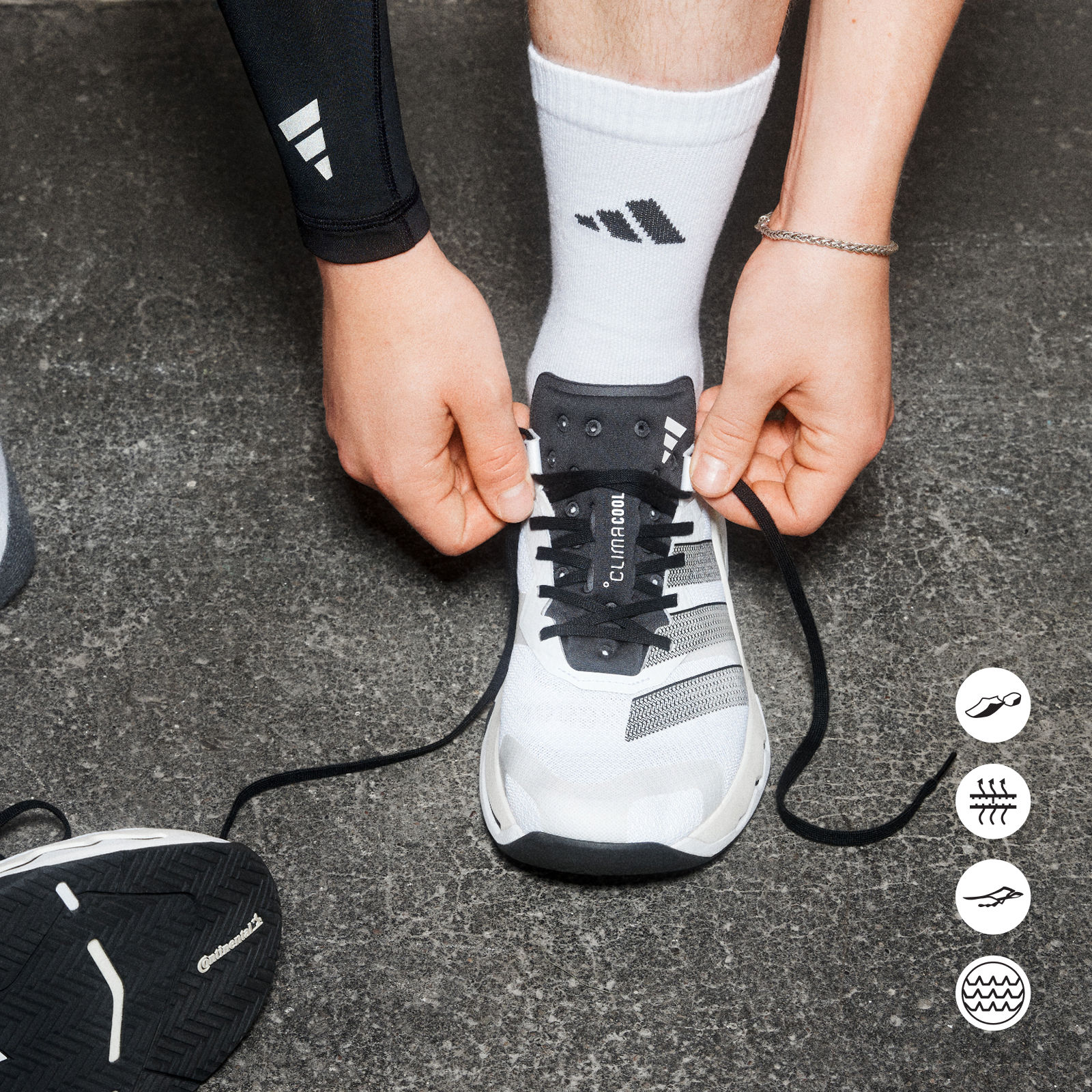 The image shows a person's hands tying the laces of a pair of athletic shoes on a concrete surface, with various sports equipment icons visible in the background.