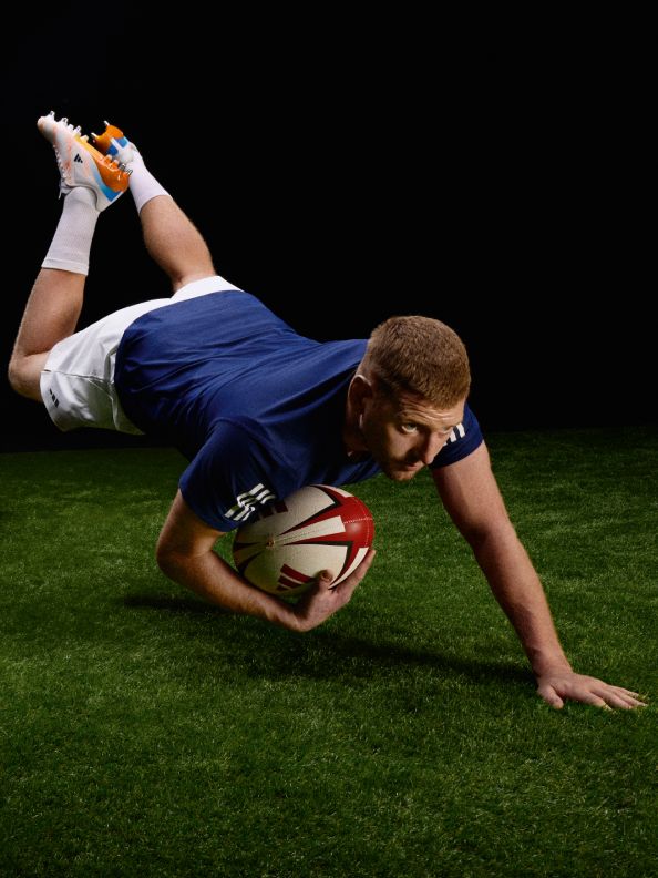 Four images showcasing the new adidas rugby boot range. The first image is an action shot of rugby player Finn Russel diving for a ball on the pitch. He's wearing the adizero RS15 Pro rugby boots in the new colourway. The third image is an action shot of rugby player Ilona Maher running with a ball on the pitch. She's wearing the Avaglide rugby boots in the new colourway. 