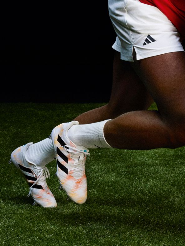 Four images showcasing the new adidas rugby boot range. The first image is an action shot of rugby player Finn Russel diving for a ball on the pitch. He's wearing the adizero RS15 Pro rugby boots in the new colourway. The third image is an action shot of rugby player Ilona Maher running with a ball on the pitch. She's wearing the Avaglide rugby boots in the new colourway.