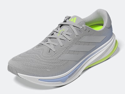The image shows the close-up view of a sneaker, with a textured mesh upper and a blue sole.