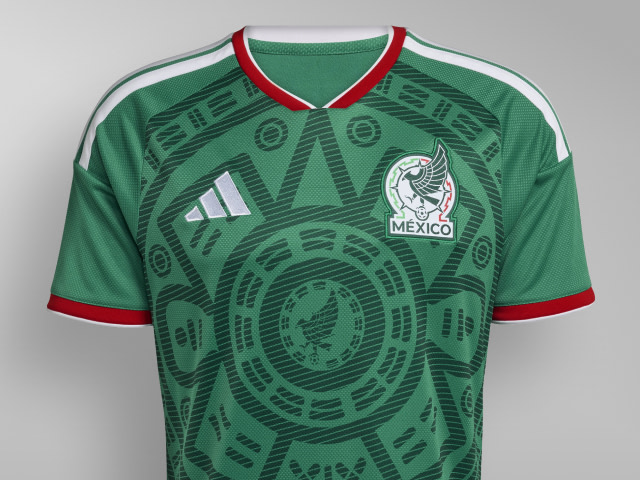 A green soccer jersey with a distinctive pattern and the Mexico national team logo prominently displayed.