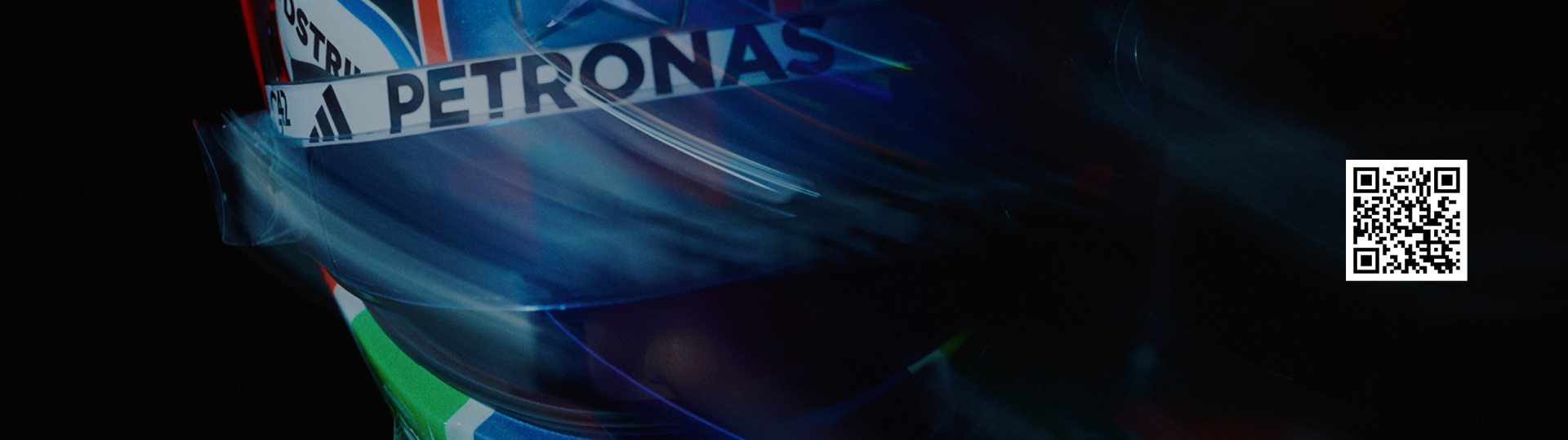 L'image présente le grand logo Petronas sur un fond abstrait et coloré de teintes bleues et vertes, créant une composition dynamique et saisissante.