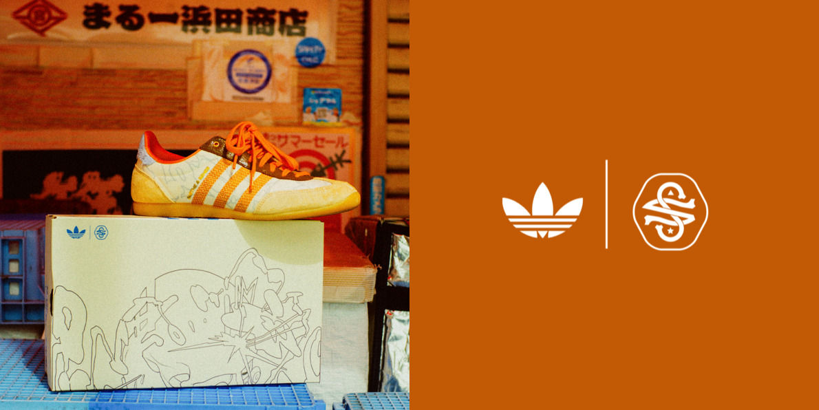 A large white and orange sneaker model is displayed prominently in the foreground, while the background features various signs and advertisements in Japanese.