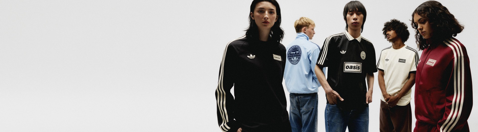 The image features three individuals wearing Adidas sportswear, including a black hooded top, a light blue shirt, and a black shirt with white stripes. They appear to be standing in a plain, light-colored setting.